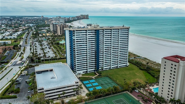 bird's eye view featuring a water view and a view of the beach