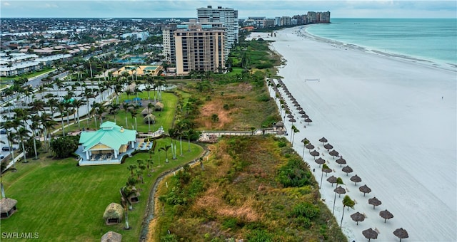 aerial view featuring a water view and a beach view