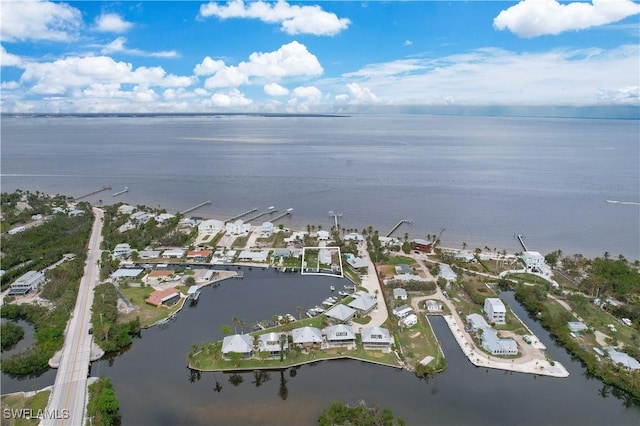 birds eye view of property featuring a water view