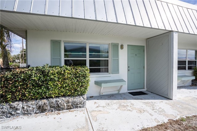 entrance to property with a patio area