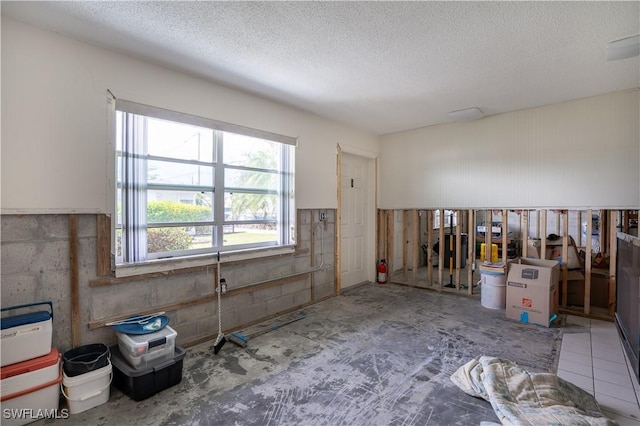 miscellaneous room featuring a textured ceiling