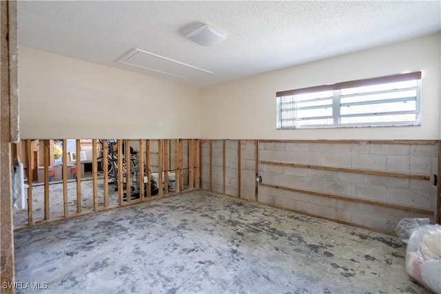 spare room with a textured ceiling