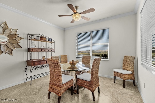 tiled dining room featuring ceiling fan and crown molding