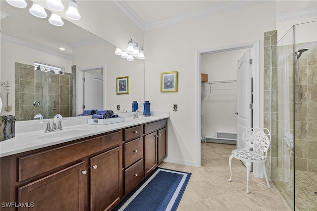 bathroom featuring tile patterned floors, vanity, a shower with shower door, and ornamental molding