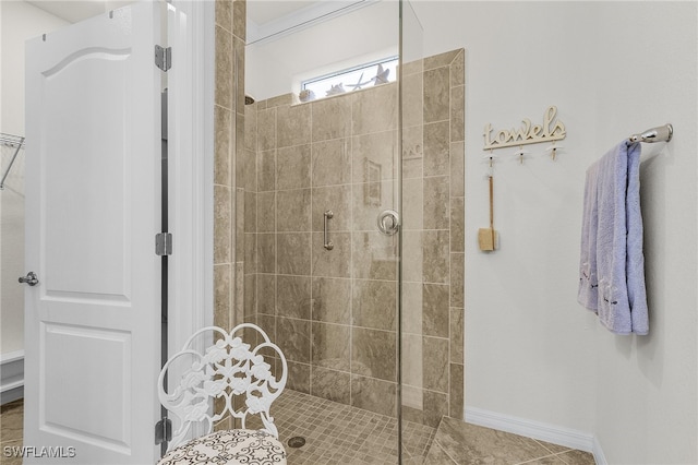 bathroom featuring a shower with door