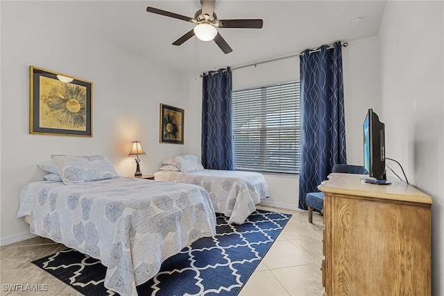 tiled bedroom with ceiling fan