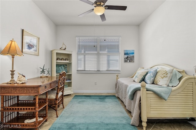 bedroom with ceiling fan and tile patterned flooring