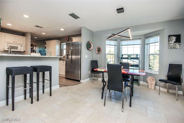 dining area with a wealth of natural light