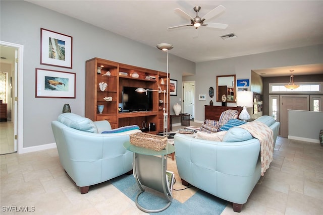 living room featuring ceiling fan