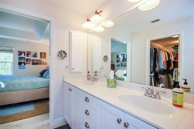 bathroom with tile patterned flooring and vanity