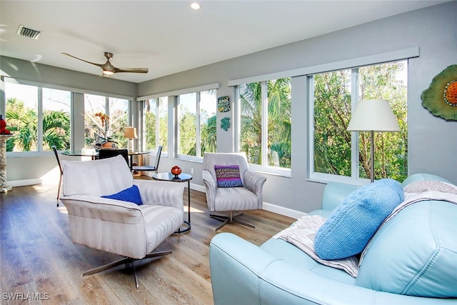 sunroom / solarium with ceiling fan