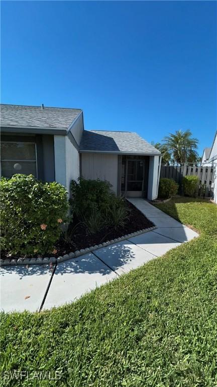 exterior space featuring a front lawn