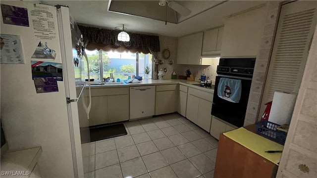 kitchen featuring white cabinets, decorative backsplash, white appliances, and ceiling fan