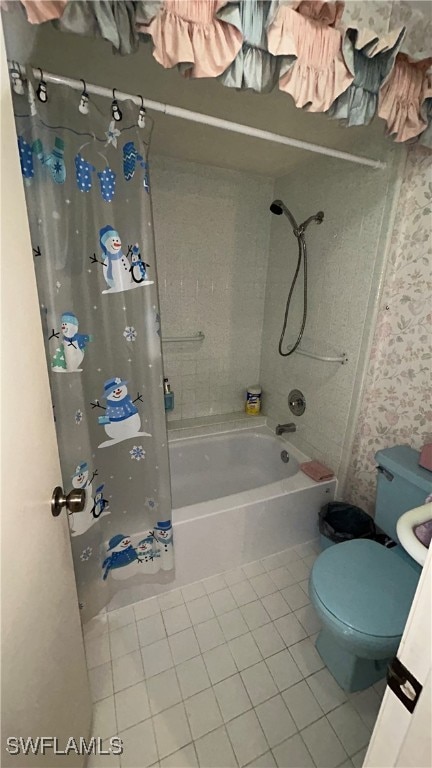 bathroom featuring tile patterned flooring, toilet, and shower / bath combo with shower curtain