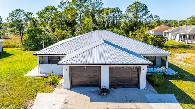 garage with a lawn