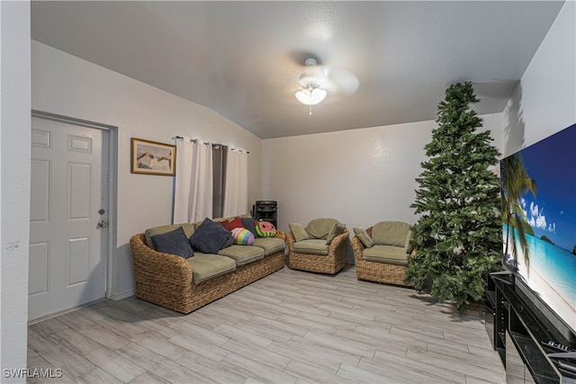 living room featuring light hardwood / wood-style floors and lofted ceiling