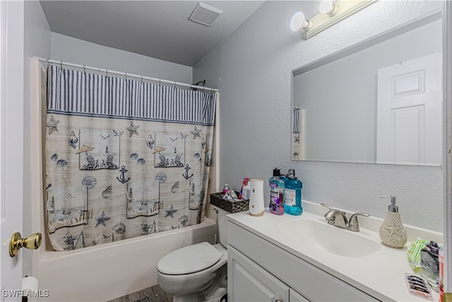 full bathroom with vanity, toilet, shower / bathtub combination with curtain, and a textured ceiling