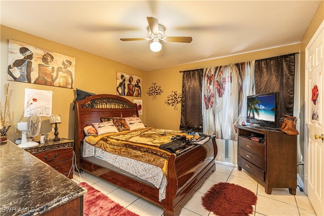 tiled bedroom with ceiling fan