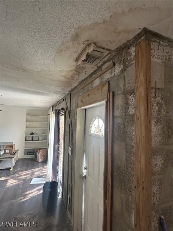 entryway with a textured ceiling