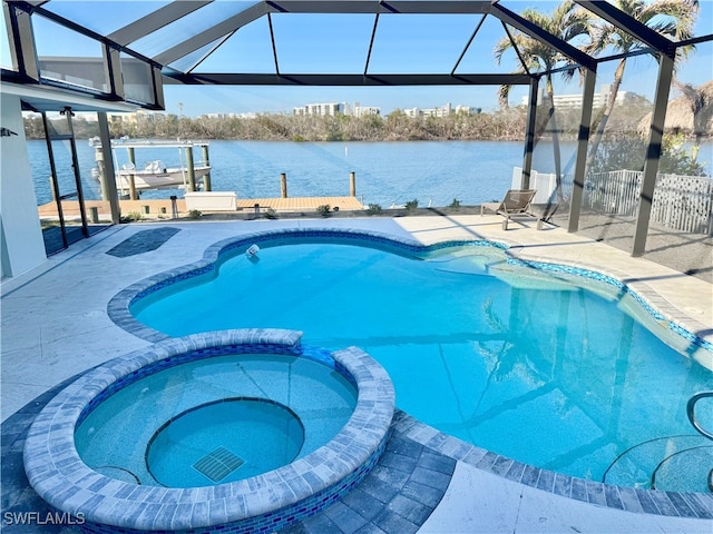 view of swimming pool featuring an in ground hot tub, a water view, glass enclosure, and a patio