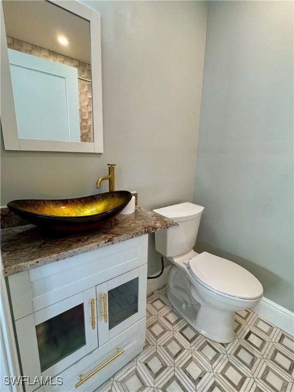 bathroom with vanity and toilet