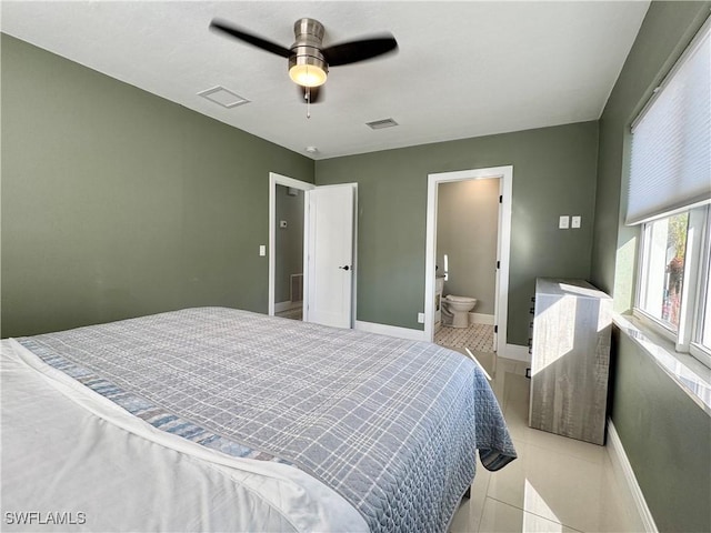 bedroom with ensuite bathroom and ceiling fan