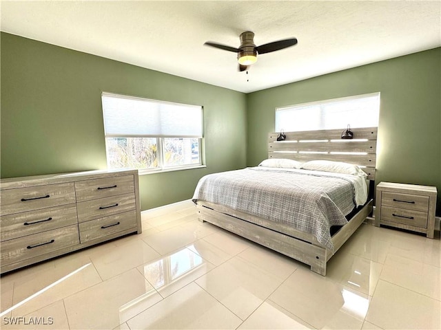 bedroom featuring ceiling fan and light tile patterned floors