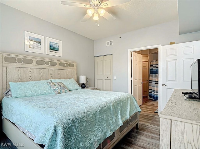 bedroom with a closet, hardwood / wood-style floors, and ceiling fan