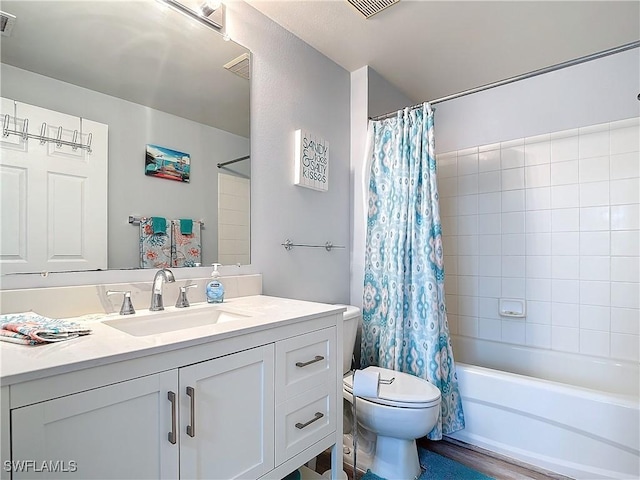 full bathroom with toilet, hardwood / wood-style floors, vanity, and shower / tub combo with curtain