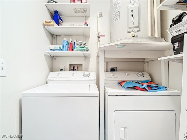 washroom featuring washing machine and dryer