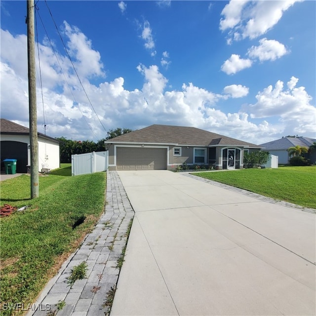 view of front facade featuring a front yard and a garage