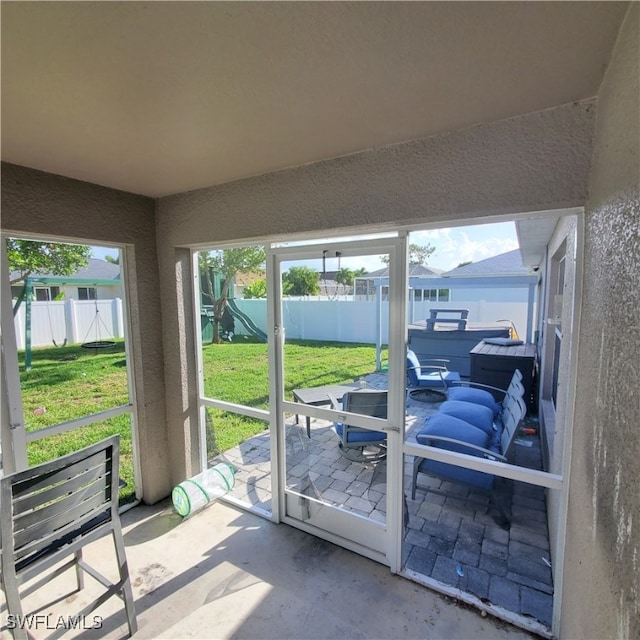 sunroom / solarium featuring plenty of natural light