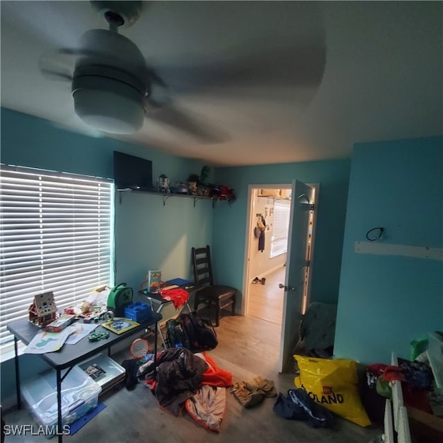 bedroom with ceiling fan and hardwood / wood-style flooring