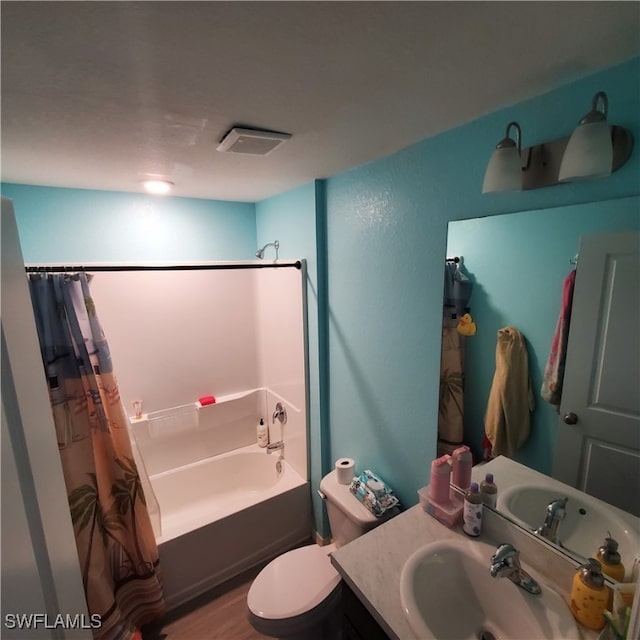 bathroom with hardwood / wood-style floors, vanity, and toilet