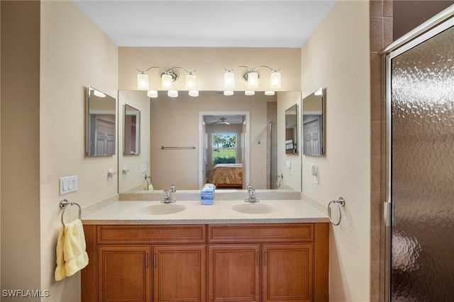 bathroom featuring vanity, an enclosed shower, and ceiling fan