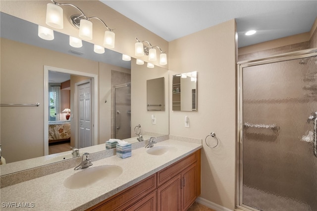 bathroom featuring vanity and an enclosed shower