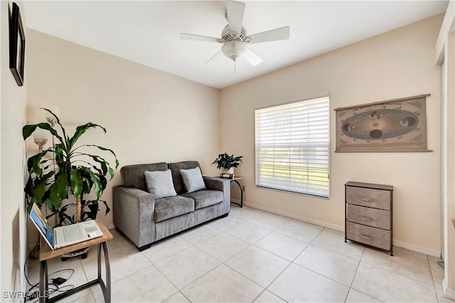 sitting room featuring light tile patterned floors and ceiling fan