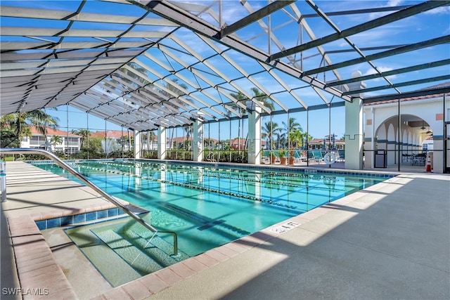 view of pool featuring a lanai and a patio