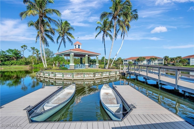 view of dock with a gazebo and a water view