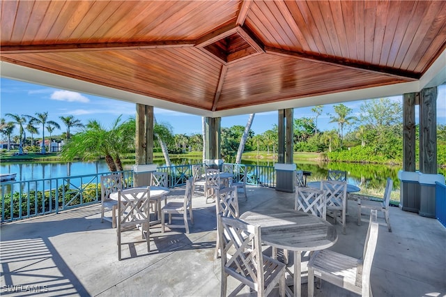 view of patio with a gazebo and a water view