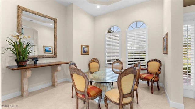 dining space with recessed lighting, baseboards, plenty of natural light, and tile patterned floors