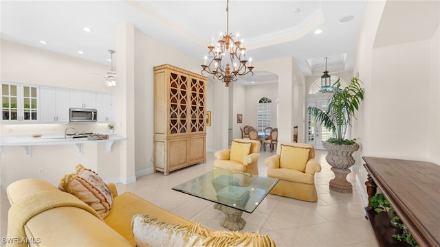 living area featuring light tile patterned floors, a raised ceiling, a towering ceiling, and recessed lighting