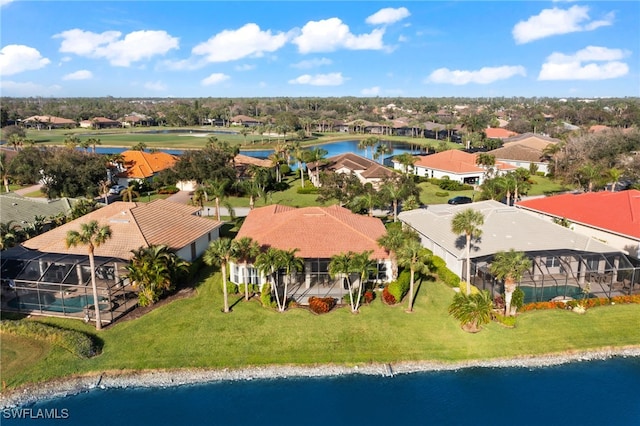 birds eye view of property featuring a residential view and a water view