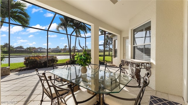 unfurnished sunroom with a water view