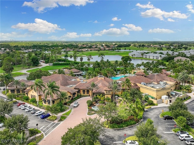 birds eye view of property featuring a water view and a residential view