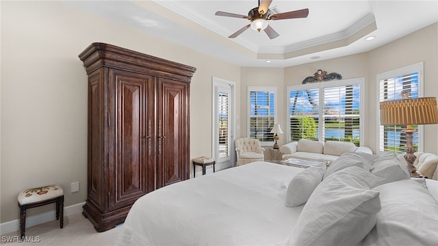 bedroom featuring a raised ceiling, ornamental molding, access to outside, light tile patterned flooring, and baseboards