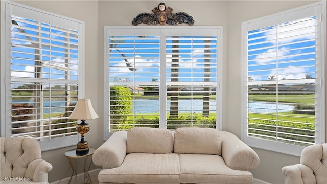 interior space with a water view and a healthy amount of sunlight