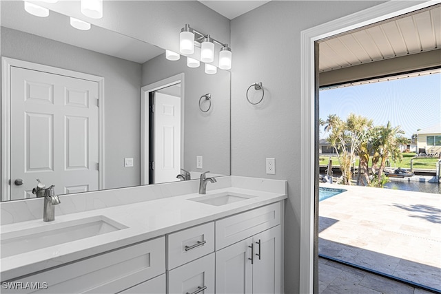 bathroom featuring a water view and vanity