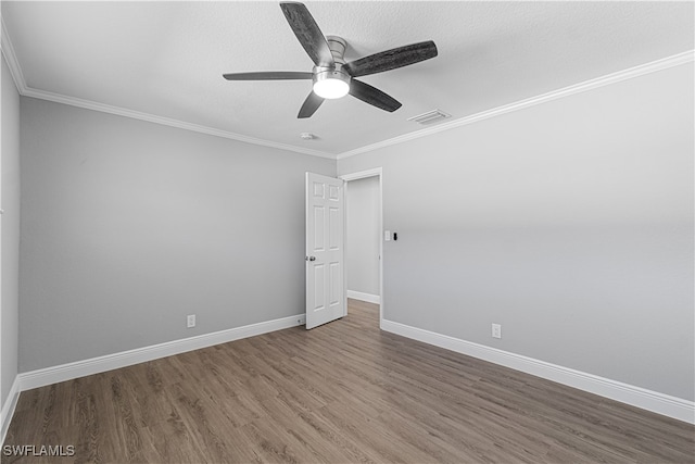 unfurnished room featuring a textured ceiling, hardwood / wood-style flooring, ceiling fan, and crown molding