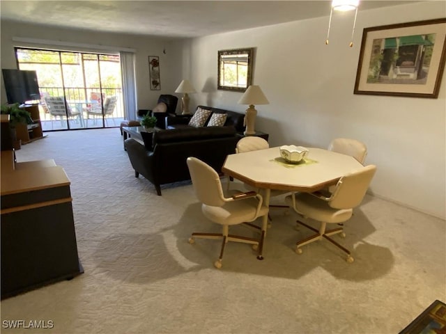 view of carpeted dining area